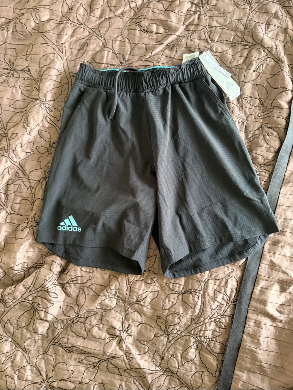 Adidas women’s Black Athletic Shorts with Aqua Logo